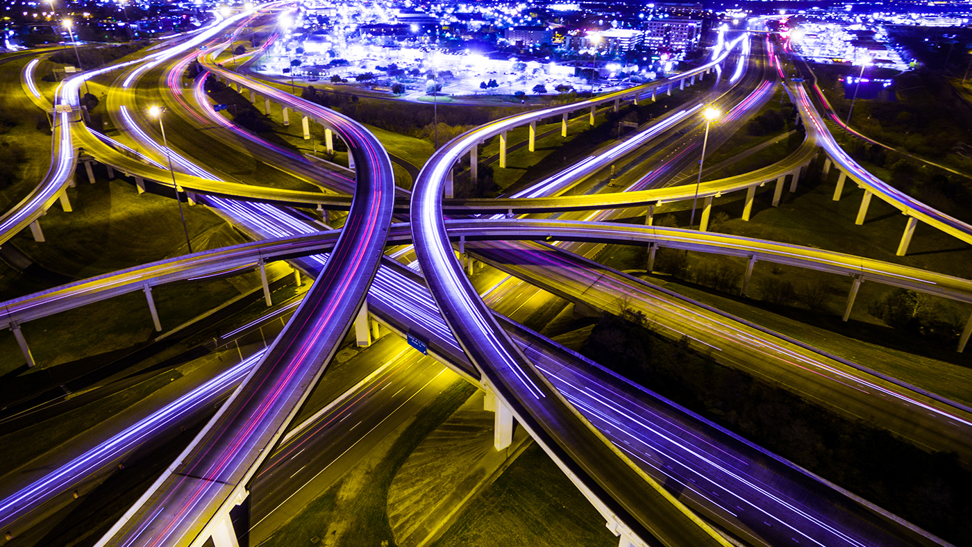 highways intersecting with purple light